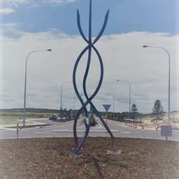 Two curved metal rods sculpture in the middle of Atlantis Beach road.