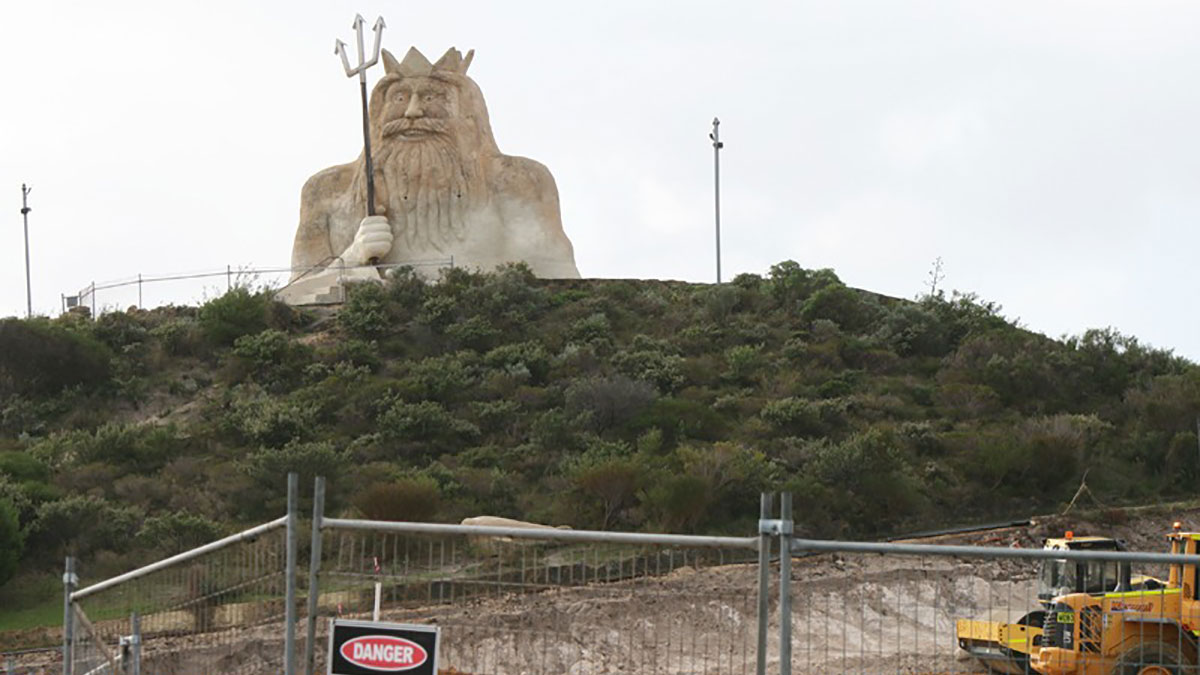 Man statue on hill overlooking Two Rocks Marina.
