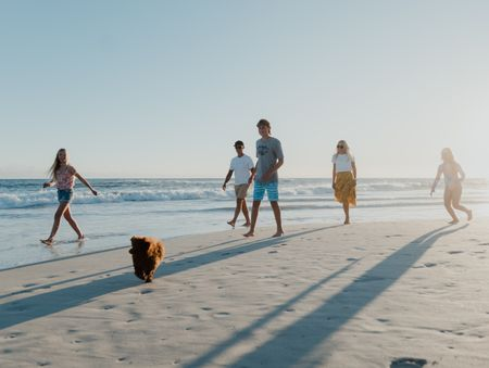 Family Enjoying Coastal Living On The Two Rocks Beach.