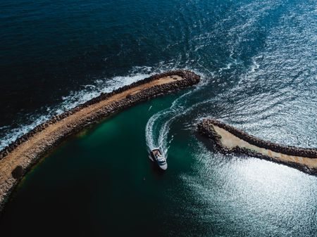 Boat Entering Two Rocks Marina On Perth'S Coast.